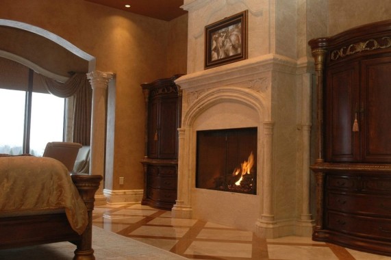 Arched Fireplace surround carved of Limestone