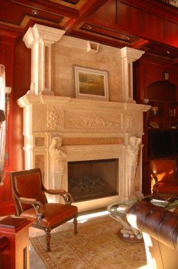 Tall Mantle Fireplace Surround with Figure Details on Legs.