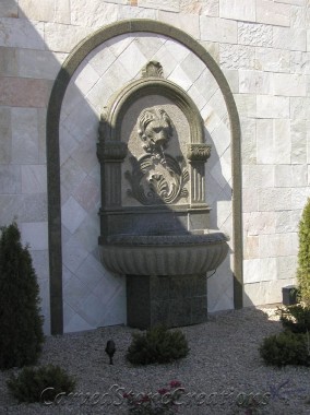 Carved granite pedestal lion wall fountain