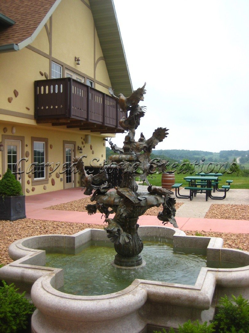 Backyard bronze statue in fountain