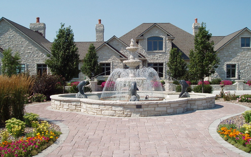 3 tiers water fountain with 4 dolphins surrounding spraying water