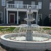 3-tier Scalloped Fountain carved of California white granite, 54" diameter x 96" tall in a 14' Diameter x 14" tall Tuscan Pool surround