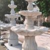 3-Tier Scallloped fountain, carved of Golden Cypress granite, 54" diameter x 96" tall