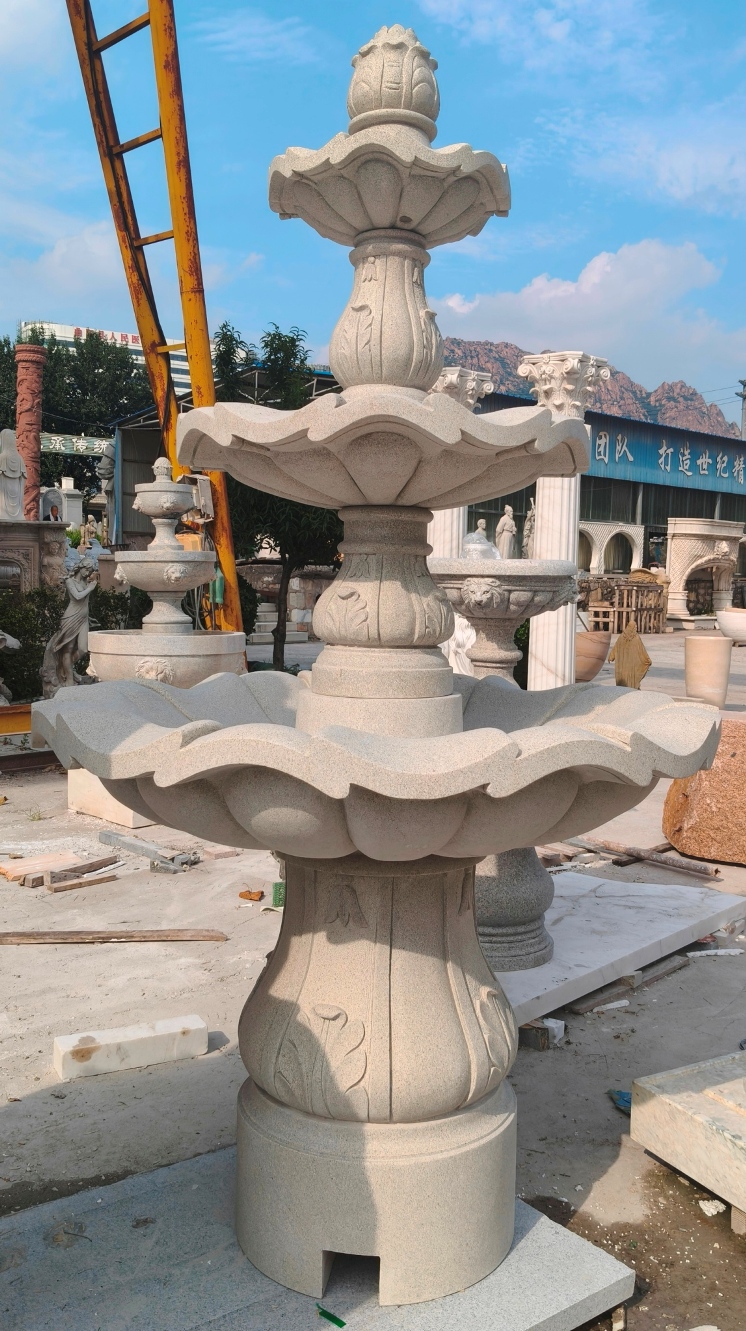 3-Tier Scallloped fountain, carved of Golden Cypress granite, 54" diameter x 96" tall