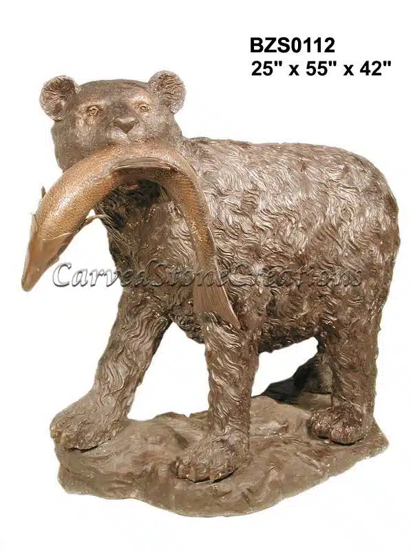 Small bear with fish in his mouth statue