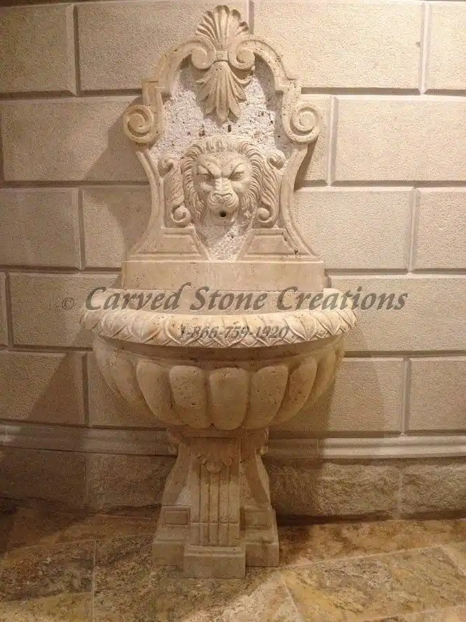Wall fountain with lion design