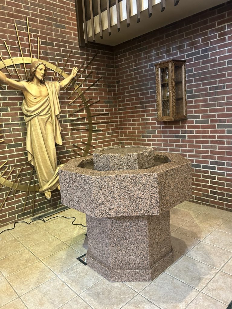 Octaogonal Baptismal Font, carved of Red B Granite