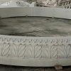 14' diameter x 14" tall relief carved pool surround, carverd of golden cyrpess granite
