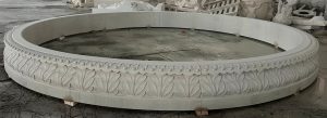 14' diameter x 14" tall relief carved pool surround, carverd of golden cyrpess granite