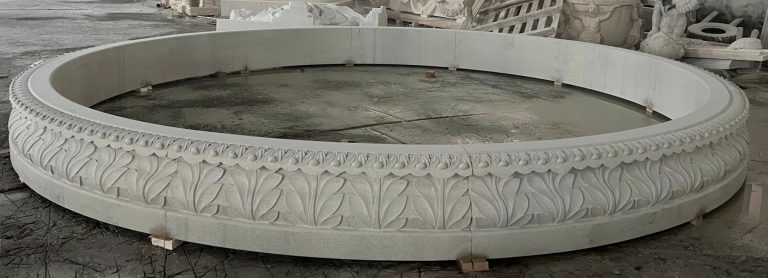 14' diameter x 14" tall relief carved pool surround, carverd of golden cyrpess granite
